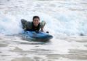 Elsie Berriman is surfing to school from Hayle to Carbis Bay