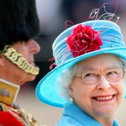 The late Queen smiling at Prince Philip on Horse Guards Parade during the annual Trooping the Colour parade in 2009 (Lewis Whyld/PA)