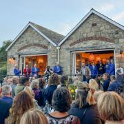 Guests gather to celebrate the official reopening of The Pier House after a devastating fire