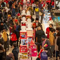 New York NY/ USA- November 23, 2018 Hordes of shoppers throng the Macy's Herald Square flagship store in New York looking for bargains on the day after Thanksgiving, Black Friday.