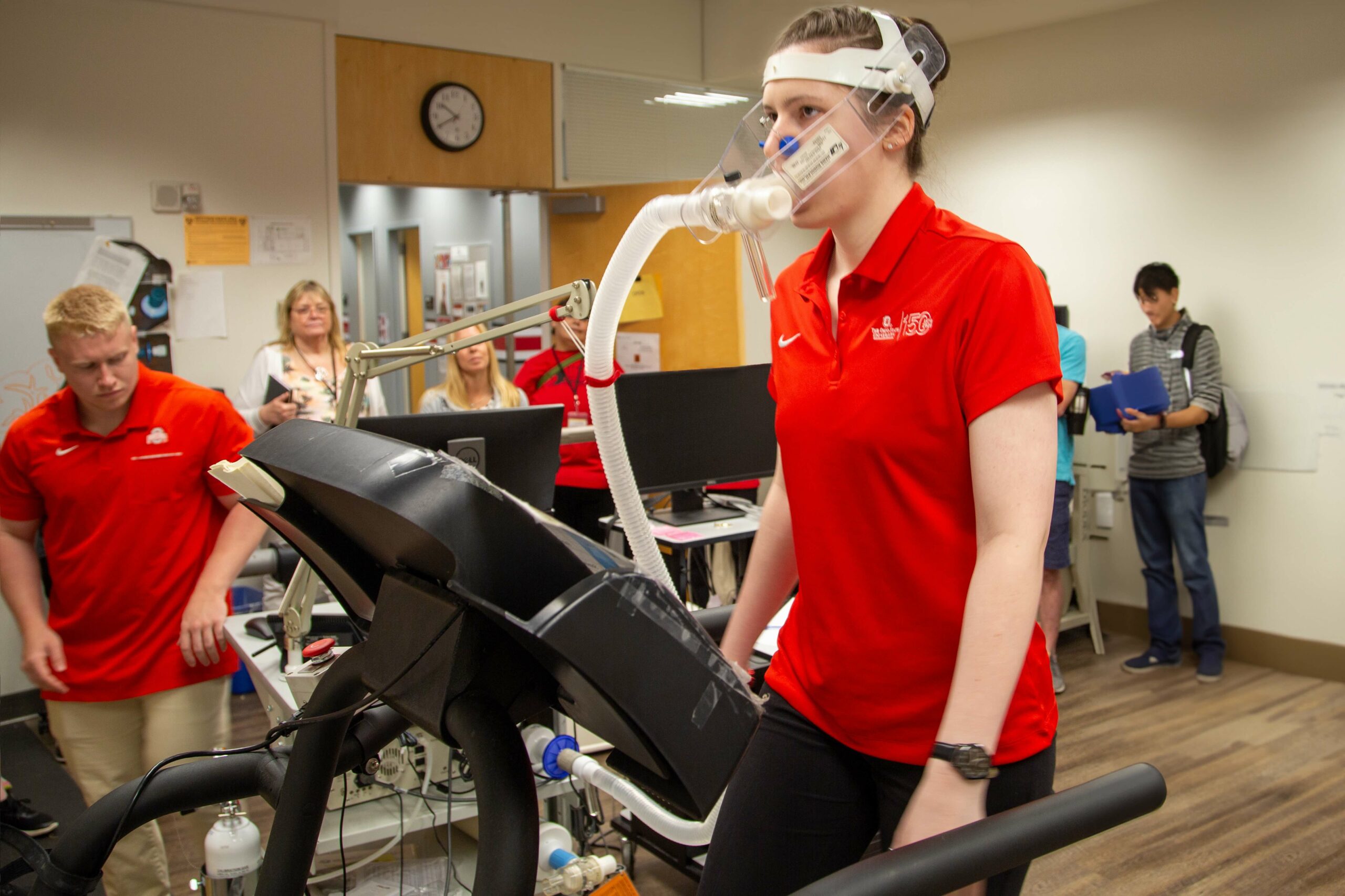 Ohio State exercise science student on a treadmill with oxygen mask