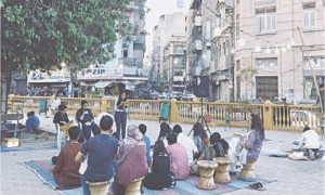 Does Karachi invest in community spaces?