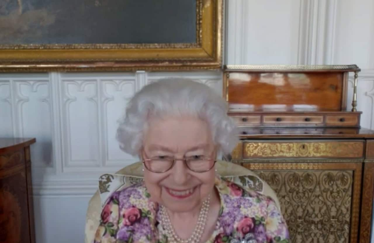 A woman smiles into the camera.