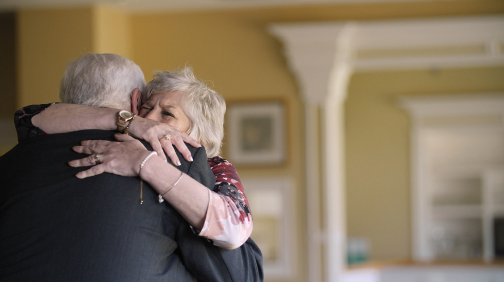 Grand Almoner's Fund recipient hugging a Scottish Rite Mason who helped her in her time of need.