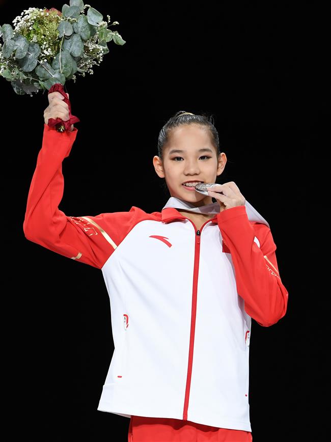 American gymnast Biles wins all-round, China's teenager Tang takes silver at worlds