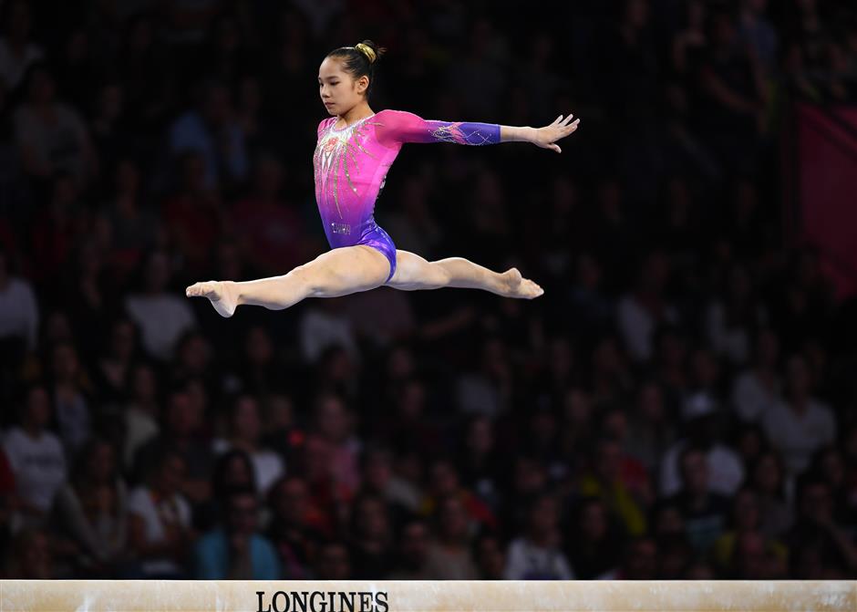 American gymnast Biles wins all-round, China's teenager Tang takes silver at worlds