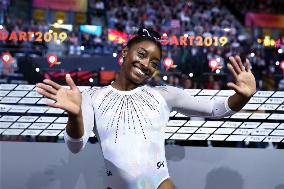 American gymnast Biles wins all-round, China's teenager Tang takes silver at worlds