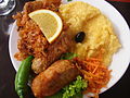 Image 7A popular Moldovan dish of Stuffed Cabbage Rolls (sarma), accompanied by sauerkraut and mămăligă. (from Culture of Moldova)