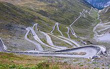 A winding road on the slopes of a mountain.