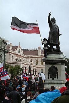 The national Māori flag (top center), Te Kara (bottom left), and several other flags were used at protests in the 2004 New Zealand foreshore and seabed controversy