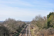 View of a railway in a cutting, with trees