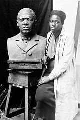 Federal Art Project sculptor Selma Burke with portrait bust of Booker T. Washington (1935)