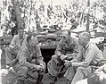 Change of command on Guadalcanal, December 1942. Maj. Gen. Alexander M. Patch, center, succeeds Maj. Gen. Alexander A. Vandegrift (USMC), right. Col. R. Hall Jeschke (USMS) briefs them.