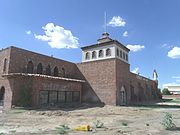 The historic El Cid Castle was a bowling alley which resembled a Moorish Castle. It was built by Dr. Kenneth Hall, a physician who served the community of Sunnyslope in Phoenix. Construction on the structure began in 1963 and was completed in 1980. It was located at the Northwest corner of 19th Ave and West Cholla Drive which is on the opposite side of Sunnyslope's western boundary.[16]