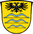 Das Wappen der Gemeinde Valley im oberbayerischen Landkreis Miesbach trägt oben den Doppeladler aus dem Herzschild des Wappens von Graf Maximilian Kurtz von Senftenau (1595–1662)