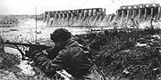 Red Army soldier near the Dnieper hydro-electric dam