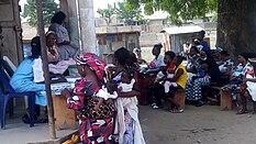 An image of mothers registering their children during immunization at primary health center in Masaka