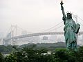 Replica Statue of Liberty with the Rainbow Bridge.