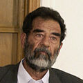 Hussein listening at the Tribunal, July 2004