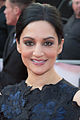 Archie Panjabi interpreta Nas Kamal