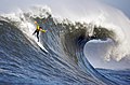 Image 41A man engaging in big wave surfing at Mavericks, located just north of Half Moon Bay, California. Big wave surfing is a discipline within surfing in which experienced surfers paddle into or are towed onto waves which are at least 20 ft (6.1 m) high, and is a hazardous activity, as surfers can be pushed far beneath the surface of the water after a wipeout.