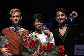 Rippon (left) at the 2013 Skate America podium