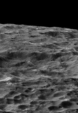 Close flyby of Dione reveals a highly cratered surface.