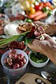 Vatcharin Bhumichitr holds some of the ingredients for Thai red curry paste in his hand