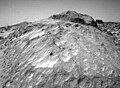 A close-up view of the rock "Moe" in the Rock Garden at the Pathfinder landing site. Moe is a meter-size boulder that, as seen from Sojourner, has a relatively smooth yet pitted texture upon close examination. Such a texture is seen on Earth on rocks that have been abraded by wind in a process that is analogous to sand blasting. This view of Moe shows two faces on the rock, one (left side of the rock) facing north-northeast and the other (right side) facing east. These two faces are thought to have been pitted and fluted by strong, "sand"- carrying winds from the northeast. This image and PIA01565(right eye) make up a stereo pair. Mars Pathfinder is the second in NASA's Discovery program of low-cost spacecraft with highly focused science goals. The Jet Propulsion Laboratory, Pasadena, CA, developed and manages the Mars Pathfinder mission for NASA's Office of Space Science, Washington, D.C. JPL is an operating division of the California Institute of Technology (Caltech).