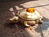 A sculpted on the steps of the temple