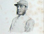 A British jockey with silk cap in 1862.