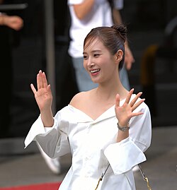 Yuri wearing red and white outfit in February 2019