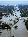 Image 5Devastation caused by Hurricane Katrina in New Orleans, Louisiana during 2005, shown here looking down on Interstate 10 at West End Boulevard towards Lake Pontchartrain. Over 1,800 people were confirmed dead with 705 still missing. It was the costliest Atlantic hurricane in history causing around $86 billion in damage. This photo shows flooded roadways as the United States Coast Guard conducted initial damage assessment overflights of New Orleans on Monday, August 29, 2005. The city flooded due primarily to the failure of the levee system. Many who remained in their homes had to swim for their lives, wade through deep water, or remain trapped in their attics or on their rooftops.