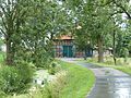 Schilderachtige boerderij aan de waterloop Ollen, Altenesch