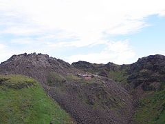 Very distant photo demonstrating the scale of the mountain