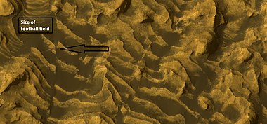 Enlargement of previous image showing a fault and layers. Image taken with HiRISE, under HiWish program.