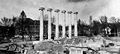 The Columns stand in the rubble of Academic Hall after the 1892 fire, the new buildings of Francis Quad in the background