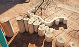 Play structure designed to look like paper going over the rollers in a printing press.