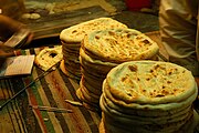 Naan being freshly prepared in a tandoor in Karachi, Pakistan.