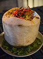 'Ho mok thale' is a Thai curry "soufflé" of mixed seafood and the soft meat of a young coconut, here served inside a coconut