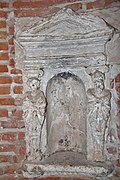 Hôtel de Brucelles: niche decorated with terms dressed in antique style in the staircase of the tower.