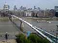 The Millennium Bridge over the River Thames in London, from Tate Modern. St. Pauls Cathedral on the left