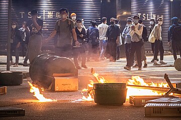 Objects being set on fire in the middle of the road