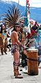 A modern Aztec drumming in traditional Aztec clothing