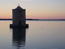 The windmill on the lagoon of Orbetello.