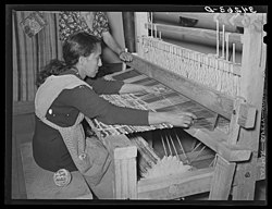 Photo of woman making a rug