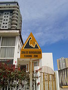 A Tsunami hazard sign (Spanish – English) in Iquique, Chile