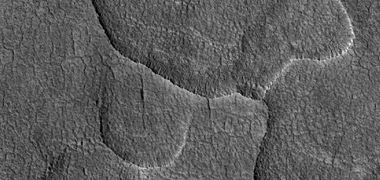 Close-up of scalloped ground, as seen by HiRISE under HiWish program. Surface is divided into polygons; these forms are common where ground freezes and thaws. Note: this is an enlargement of a previous image.