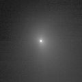 This image shows comet Tempel 1 as seen through the clear filter of the medium resolution imager camera on Deep Impact. It was taken on June 25, 2005, when the spacecraft was 8,007,845.1 kilometers (4,976,075 miles) away from the comet. Ten images were combined to create this picture, and a logarithmic stretch was applied to enhance the coma of the comet.