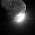 This image shows the initial ejecta that resulted when NASA's Deep Impact probe collided with comet Tempel 1 at 10:52 p.m. Pacific time, July 3 (1:52 a.m. Eastern time, July 4). It was taken by the spacecraft's high-resolution camera 13 seconds after impact. The image has been digitally processed to better show the comet's nucleus.